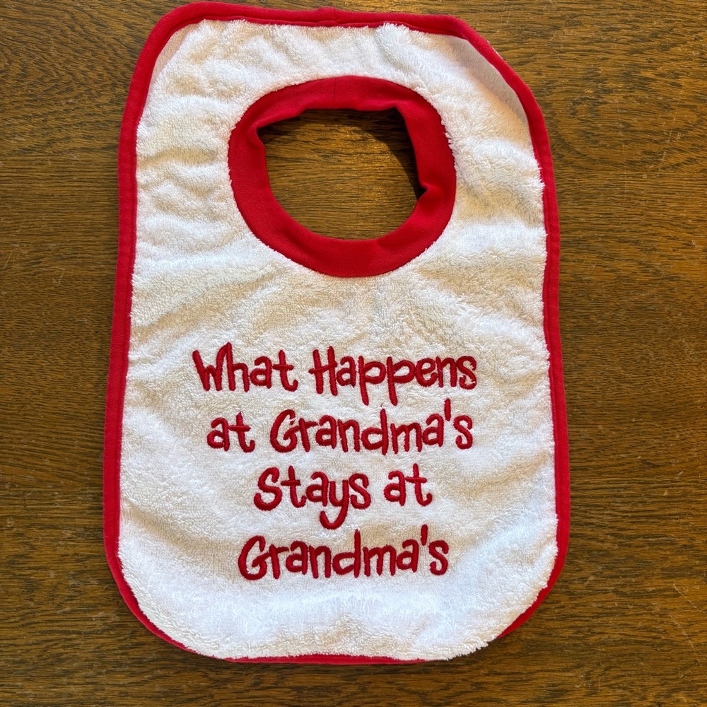 What Happens at Grandma's Stays at Grandma's Child Baby Pullover Bib White Red
